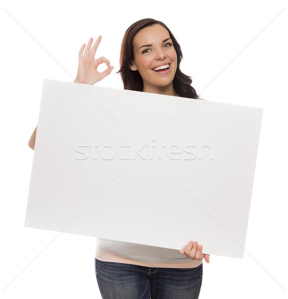 Smiling Mixed Race Female Holding Blank Sign on White
 Stock photo © feverpitch
