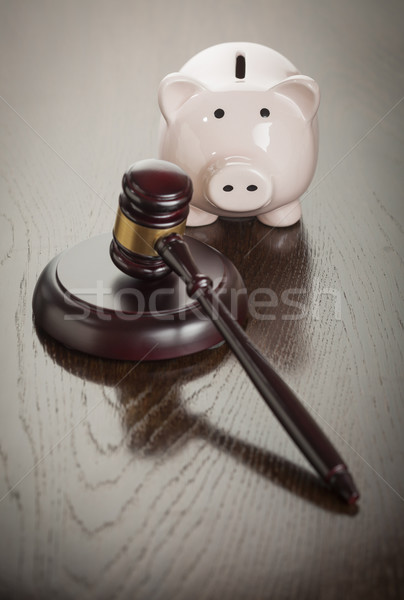 Gavel and Piggy Bank on Table Stock photo © feverpitch