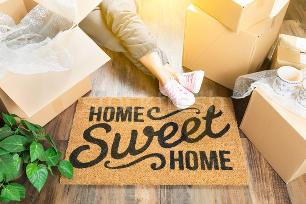 Woman Wearing Sweats Relaxing Near Home Sweet Home Welcome Mat,  Stock photo © feverpitch