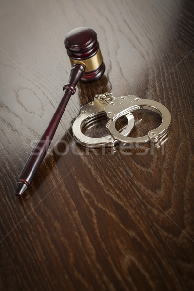 Gavel and Pair of Handcuffs on Table Stock photo © feverpitch