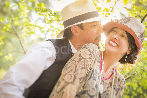 1920s Dressed Romantic Couple Flirting Outdoors Stock photo © feverpitch