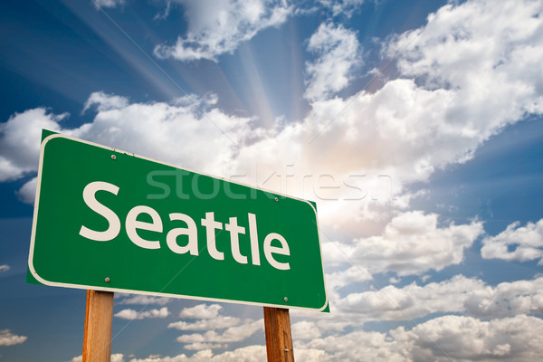 Seattle Green Road Sign Over Clouds Stock photo © feverpitch