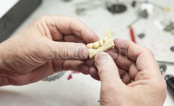 Dental Technician Working On 3D Printed Mold For Tooth Implants Stock photo © feverpitch