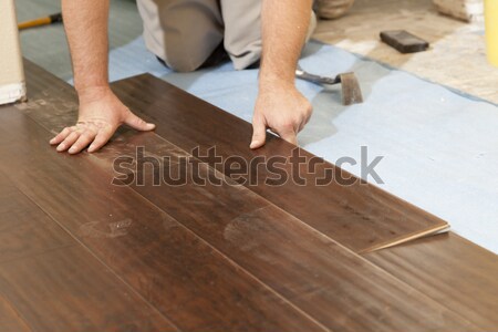 Férfi installál új fa parketta absztrakt Stock fotó © feverpitch