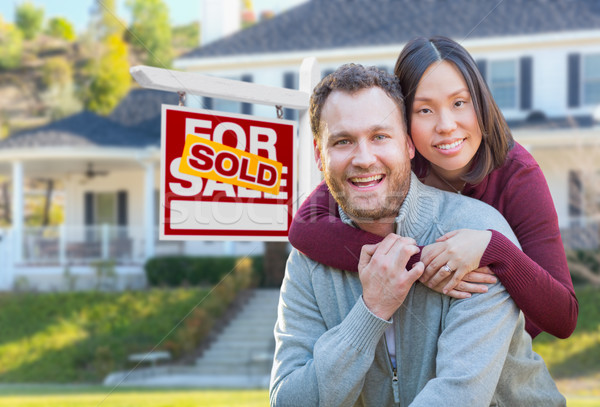 Mixed Race Caucasian and Chinese Couple In Front of Sold For Sal Stock photo © feverpitch