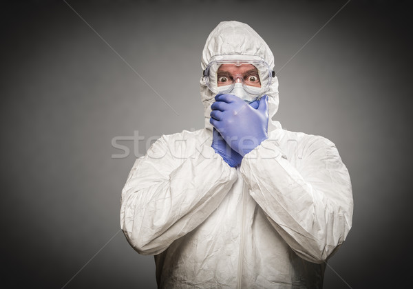 Man Covering Mouth With Hands Wearing HAZMAT Protective Clothing Stock photo © feverpitch