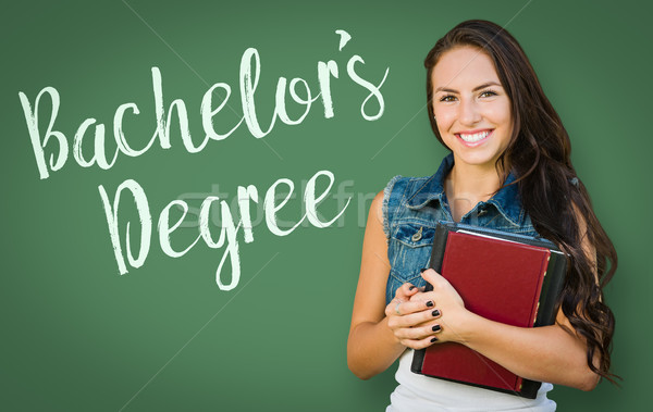 Bachelors Degree Written On Chalk Board Behind Mixed Race Young  Stock photo © feverpitch