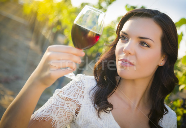 Stock photo: Young Adult Woman Enjoying A Glass of Wine in Vineyard