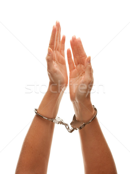 Handcuffed Woman Raising Hands in Air on White Stock photo © feverpitch