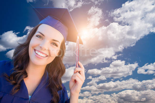 Happy Graduating Mixed Race Woman In Cap and Gown Stock photo © feverpitch