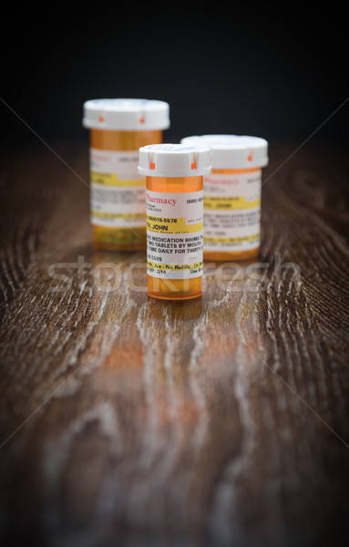 Választék vényköteles gyógyszer üvegek tükröződő fából készült felület Stock fotó © feverpitch