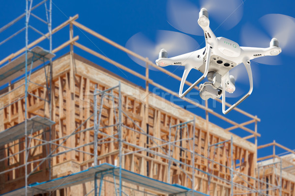 Drone Quadcopter Flying and Inspecting Construction Site Stock photo © feverpitch