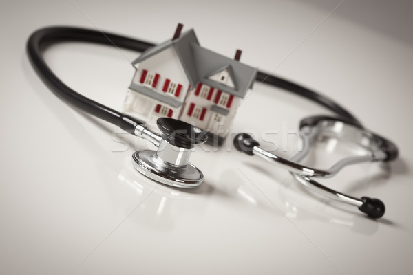 Stethoscope with Small Model Home Stock photo © feverpitch