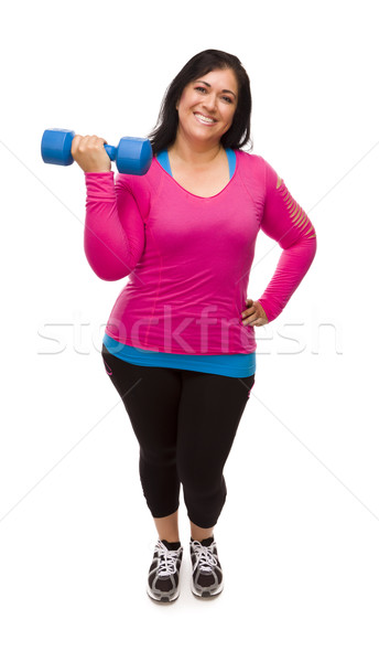 Stock photo: Hispanic Woman In Workout Clothes Lifting Dumbbell