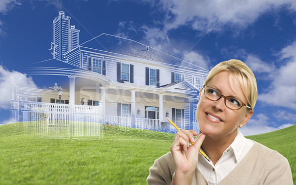 Smiling Woman Holding Pencil Looking to Ghosted House Drawing Be Stock photo © feverpitch