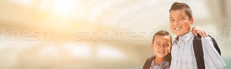 Two Young Hispanic Students Wearing Backpacks with Room For Text Stock photo © feverpitch