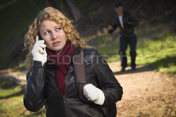 Pretty Young Teen Girl Walking with Man Lurking Behind Her Stock photo © feverpitch