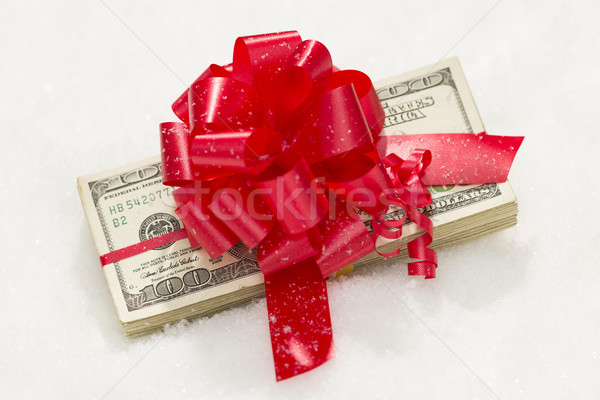 Stack of Hundred Dollar Bills with Red Ribbon on Snow Stock photo © feverpitch