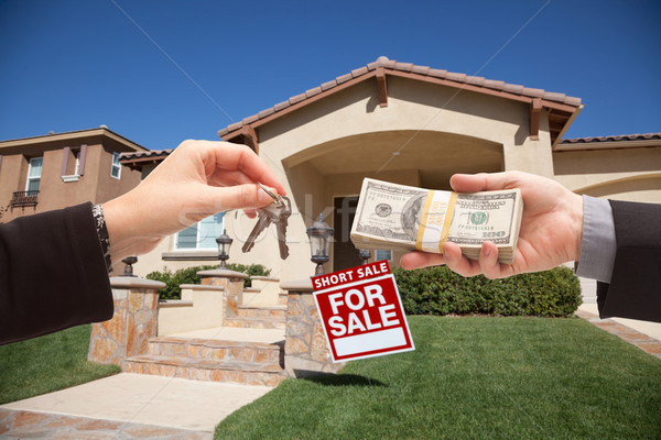 Handing Over Cash For House Keys and Short Sale Sign Stock photo © feverpitch