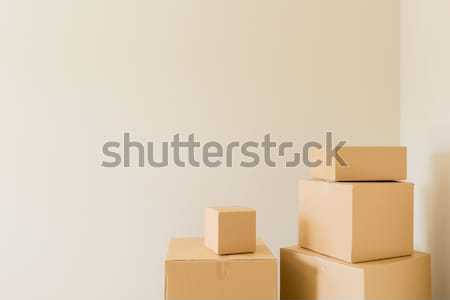 Stock photo: Variety of Packed Moving Boxes In Empty Room