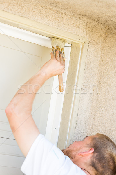 Professional Painter Cutting In With Brush to Paint Garage Door  Stock photo © feverpitch