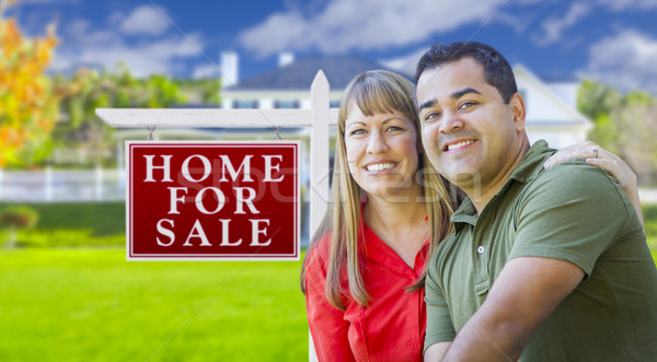 Couple in Front of For Sale Sign and House Stock photo © feverpitch