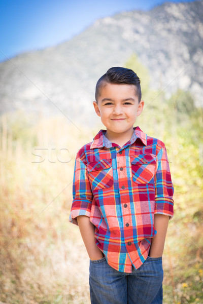 Stock photo: Mixed Race Young Boy Standing Outdoors.