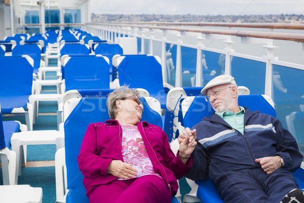 Senior Couple Relaxing On The Deck Of Cruise Ship Stock photo © feverpitch