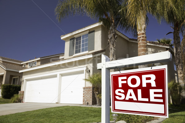 Stock photo: Red For Sale Real Estate Sign and House