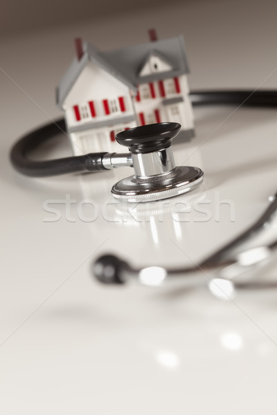 Stethoscope with Small Model Home Stock photo © feverpitch