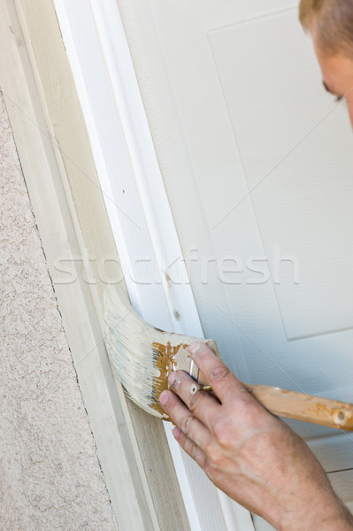 Professional Painter Cutting In With Brush to Paint Garage Door  Stock photo © feverpitch