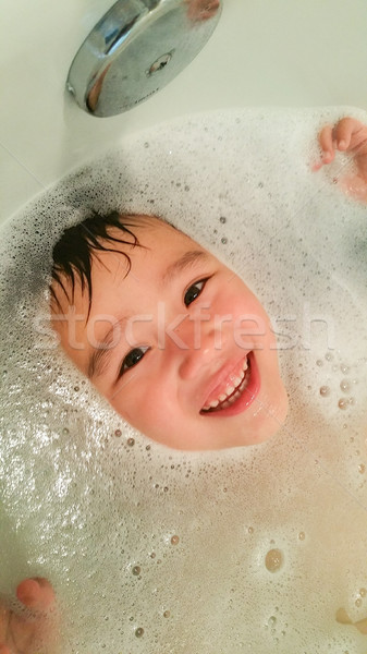 Happy Cute Young Chinese and Caucasian Boy Having Fun at Bath Ti Stock photo © feverpitch
