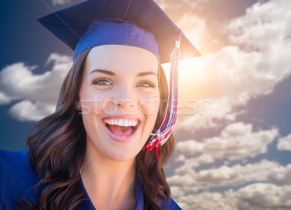 Happy Graduating Mixed Race Woman In Cap and Gown Stock photo © feverpitch