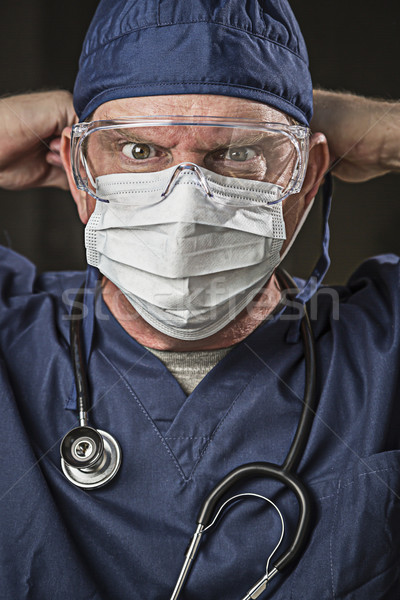 Determined Looking Doctor or Nurse with Protective Wear and Stet Stock photo © feverpitch
