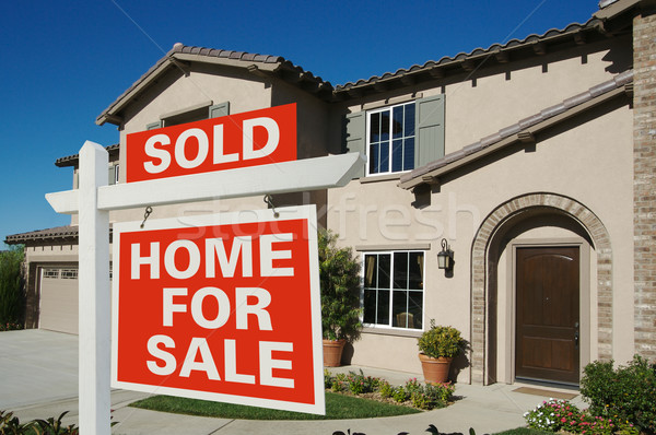 Sold Home For Sale Sign & New House Stock photo © feverpitch