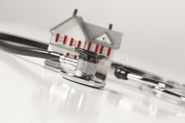 Stethoscope with Small Model Home Stock photo © feverpitch