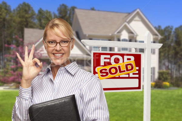 Stock photo: Real Estate Agent in Front of Sold Sign and House