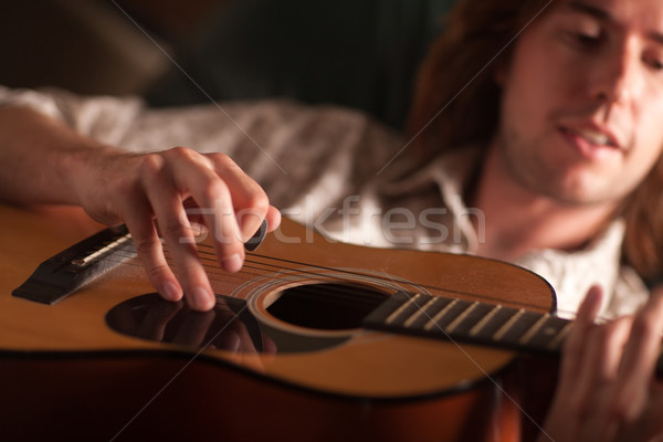 Young Musician Plays His Acoustic Guitar Stock photo © feverpitch