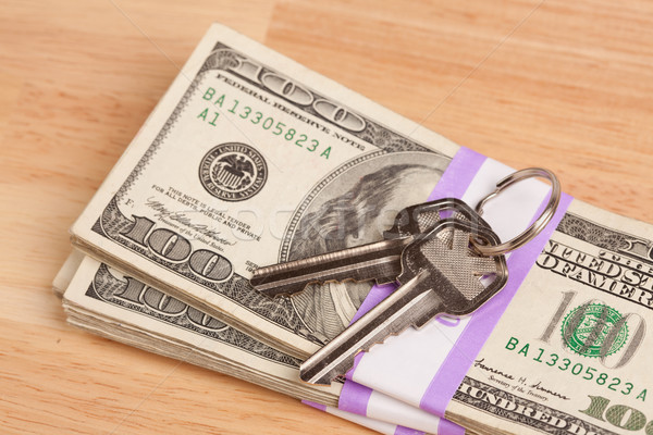 House Keys on Stack of Money Stock photo © feverpitch