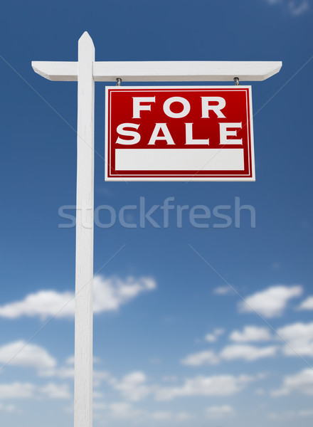 Stock photo: Right Facing For Sale Real Estate Sign on a Blue Sky with Clouds