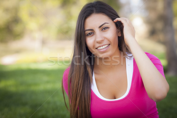 Gyönyörű félvér fiatal nő portré kívül fű Stock fotó © feverpitch