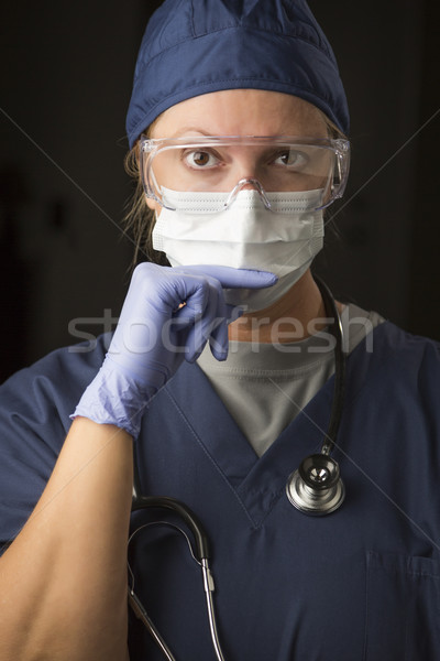 Stock photo: Concerned Female Doctor or Nurse Wearing Protective Facial Wear