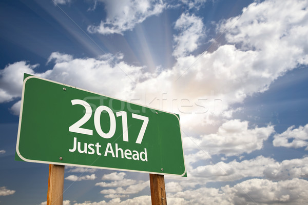 2017 Just Ahead Green Road Sign Against Clouds Stock photo © feverpitch