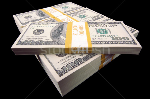 Hundred Dollar Bills On A Black Background Stock photo © feverpitch