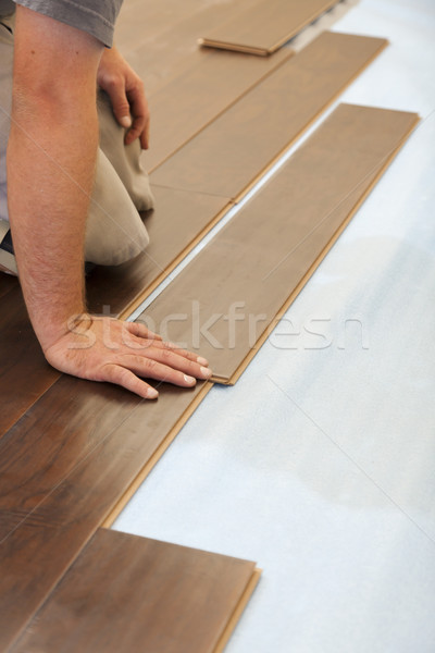 Mann Installation neue Holz Bodenbelag abstrakten Stock foto © feverpitch