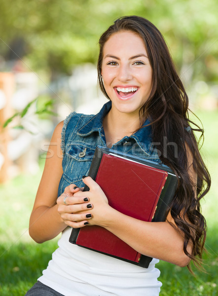 Attractive Smiling Mixed Race Young Girl Student with School Boo Stock photo © feverpitch