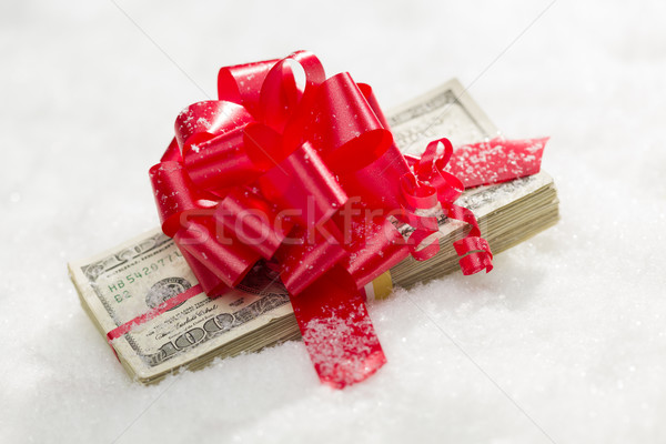 Stack of Hundred Dollar Bills with Red Ribbon on Snow Stock photo © feverpitch