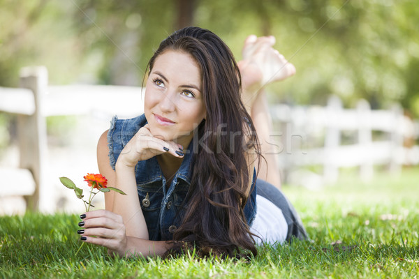 Attractive Mixed Race Girl Portrait Laying in Grass Stock photo © feverpitch
