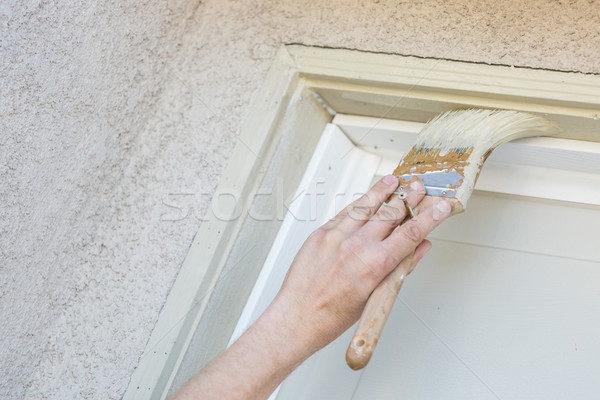 Professional Painter Cutting In With Brush to Paint Garage Door  Stock photo © feverpitch