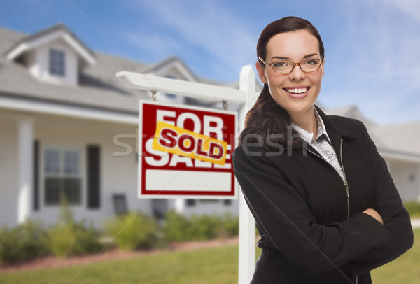 Mixed Race Woman in Front of House and Sold Sign Stock photo © feverpitch